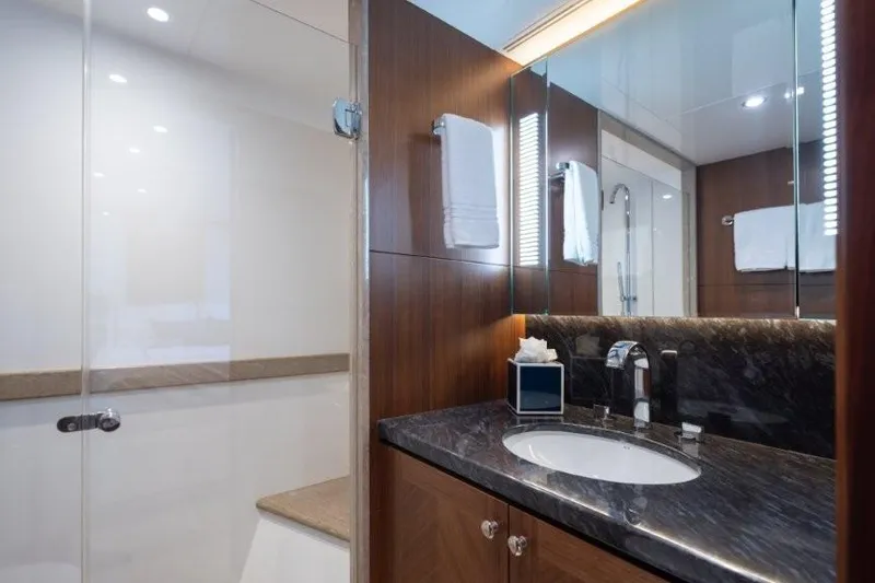Slide: The Image of Luxurious bathroom in 2017 Ocean Alexander motor yacht with elegant wood and marble finishes. - 55