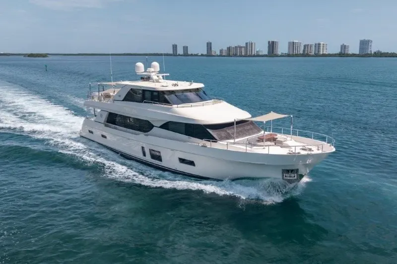 Slide: The Image of 2017 Ocean Alexander Motor Yacht cruising on blue waters near a city skyline. - 6