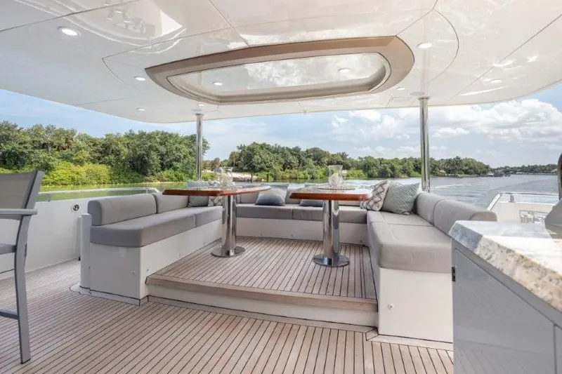 Slide: The Image of Luxurious 2017 Ocean Alexander motor yacht with elegant outdoor seating and scenic water views. - 65