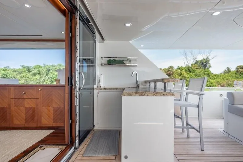 Slide: The Image of Luxurious 2017 Ocean Alexander motor yacht interior with sleek bar and seating area. - 68