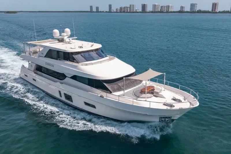 Slide: The Image of 2017 Ocean Alexander Motor Yacht cruising on open water near city skyline. - 7