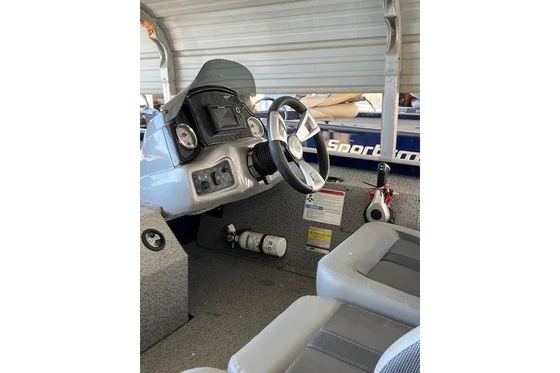 Slide: The Image of 2025 G3 Sportsman 1810 boat interior with steering wheel and dashboard controls. - 4