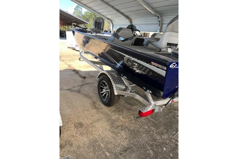 Slide: The Image of 2025 G3 Sportsman 1810 boat on trailer under a metal canopy. - 5