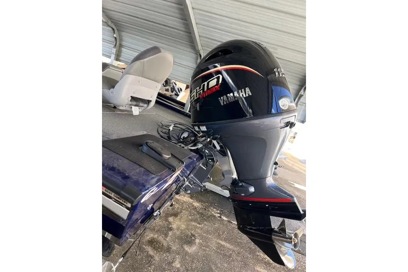 Slide: The Image of 2025 G3 Sportsman 1810 boat with Yamaha outboard motor under a metal canopy. - 6