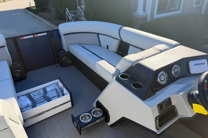 Slide: The Image of 2026 Crest Conquest 230 L boat interior with luxurious seating and modern design. - 13
