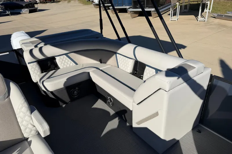 Slide: The Image of 2026 Crest Conquest 230 L boat interior with plush seating and modern design. - 14