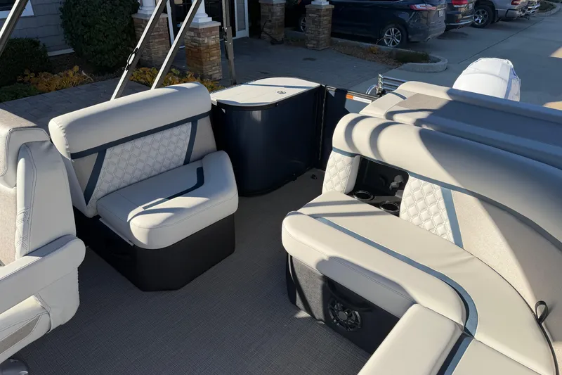 Slide: The Image of 2026 Crest Conquest 230 L boat interior with luxurious seating and cup holders. - 15