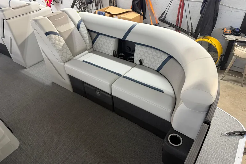 Slide: The Image of 2026 Crest Conquest 230 L boat interior with luxurious seating and modern design. - 24