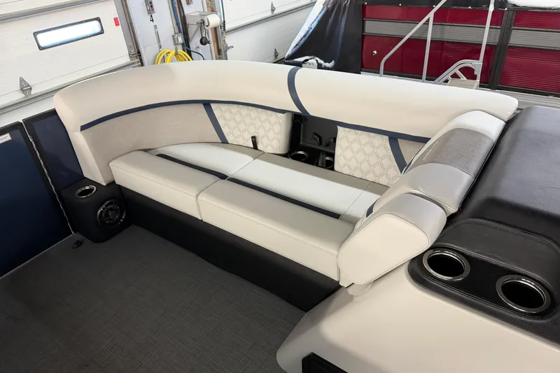 Slide: The Image of 2026 Crest Conquest 230 L boat interior with plush seating and modern design. - 30