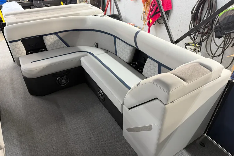Slide: The Image of Interior of 2026 Crest Conquest 230 L boat with stylish seating and storage. - 31