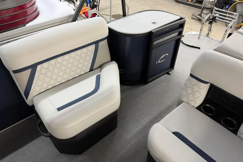 Slide: The Image of 2026 Crest Conquest 230 L boat interior with elegant seating and cup holders. - 32