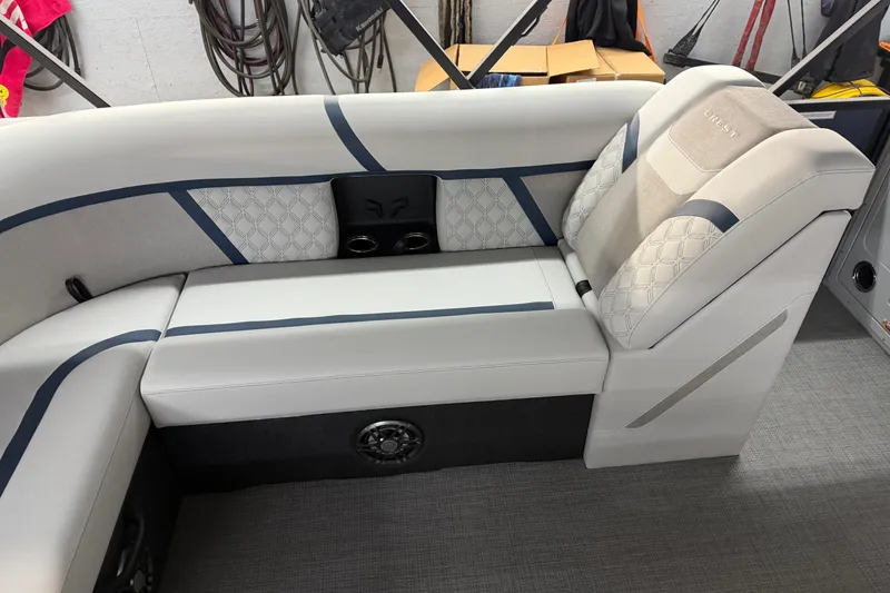 Slide: The Image of 2026 Crest Conquest 230 L boat interior with luxurious seating and cup holders. - 33
