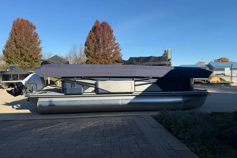 Slide: The Image of 2026 Crest Conquest 230 L pontoon boat with spacious seating and modern design. - 5