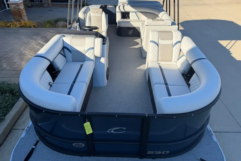 Slide: The Image of 2026 Crest Conquest 230 L boat interior with luxurious seating and cup holders. - 6