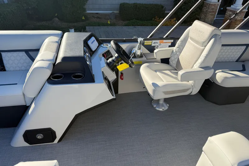 Slide: The Image of Captain's seat on 2026 Crest Conquest 230 L boat, featuring luxurious upholstery and modern controls. - 9