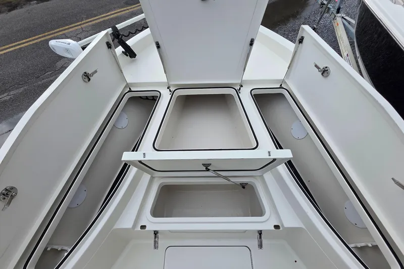 Slide: The Image of 2019 Ranger 2510 Bay Ranger boat interior with dual seats and steering console. - 12