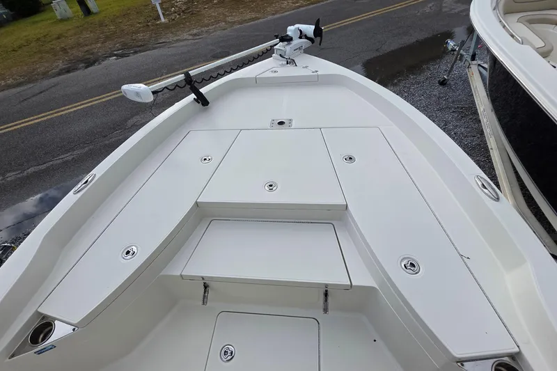 Slide: The Image of 2019 Ranger 2510 Bay Ranger boat with dual cushioned seats and steering console. - 13