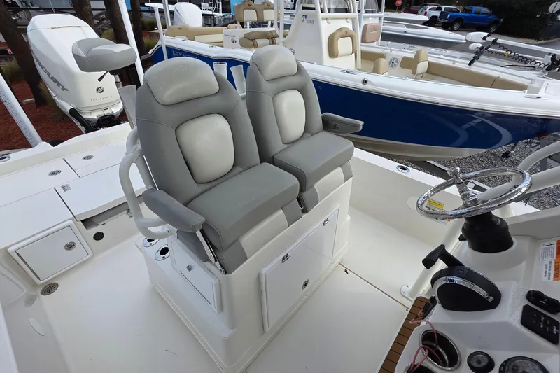 Slide: The Image of 2019 Ranger 2510 Bay Ranger boat console with Simrad displays and steering wheel. - 14
