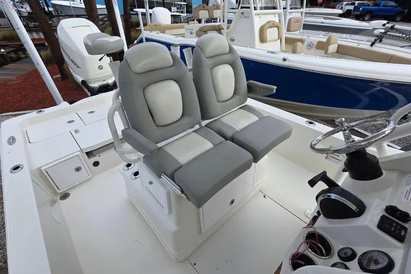Slide: The Image of 2019 Ranger 2510 Bay Ranger boat console with control panel and seating. - 15