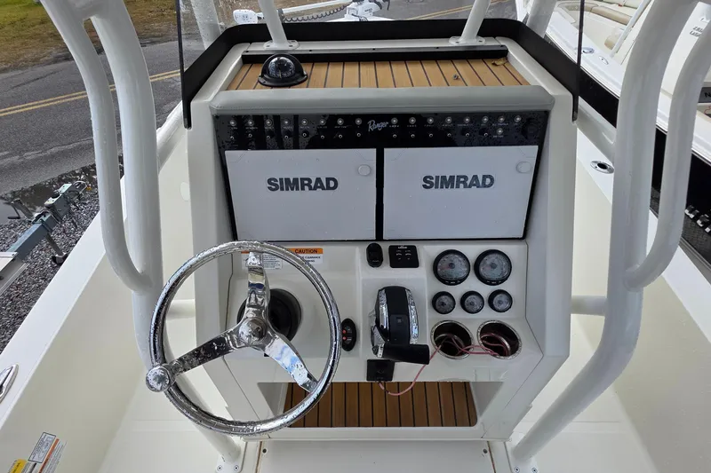 Slide: The Image of 2019 Ranger 2510 Bay Ranger boat interior with seating and storage compartments. - 16