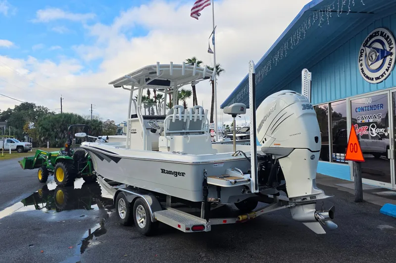 Slide: The Image of 2019 Ranger 2510 Bay Ranger boat deck with storage compartments and swivel seat. - 5