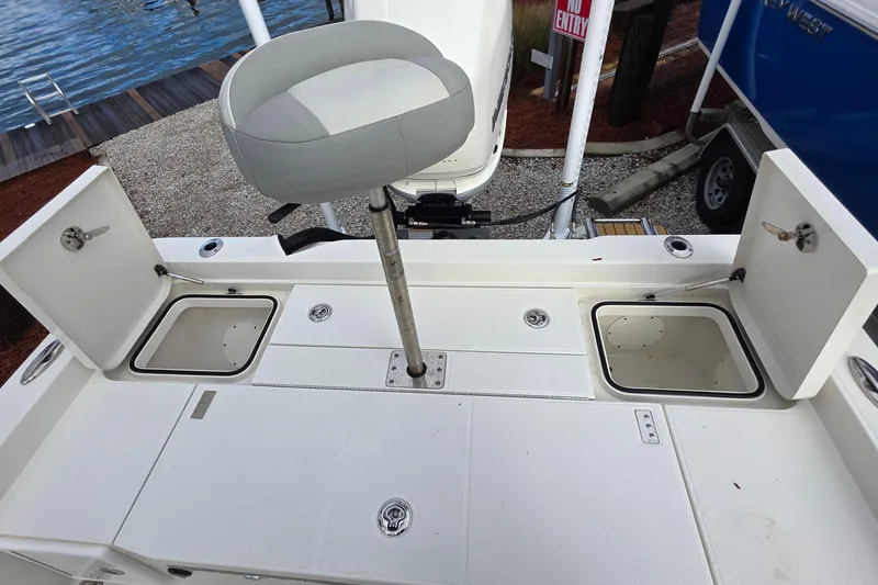 Slide: The Image of 2019 Ranger 2510 Bay Ranger boat deck with storage compartments and trolling motor. - 7