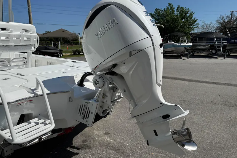 Slide: The Image of 2026 Blazer 2550 GTS boat with Yamaha outboard motor in a parking lot. - 10