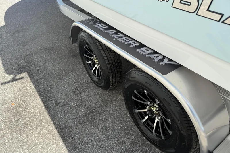 Slide: The Image of 2026 Blazer 2550 GTS trailer with dual black wheels on asphalt. - 12