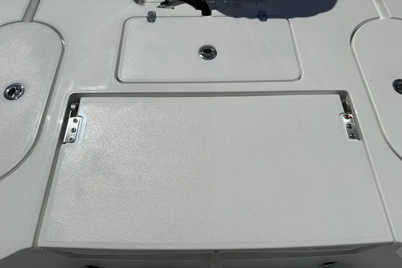 Slide: The Image of 2026 Blazer 2550 GTS boat deck with storage compartments and sleek design. - 16