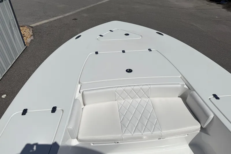 Slide: The Image of 2026 Blazer 2550 GTS boat with white seating and storage compartments. - 29