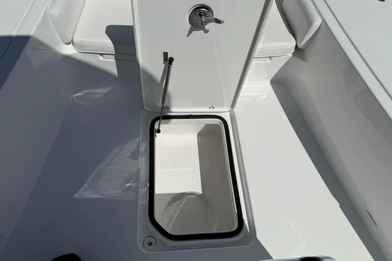 Slide: The Image of Open storage compartment on 2026 Blazer 2550 GTS boat deck. - 31