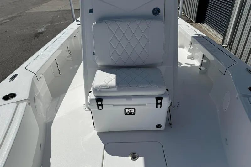 Slide: The Image of 2026 Blazer 2550 GTS boat interior with cushioned seating and K2 cooler. - 33