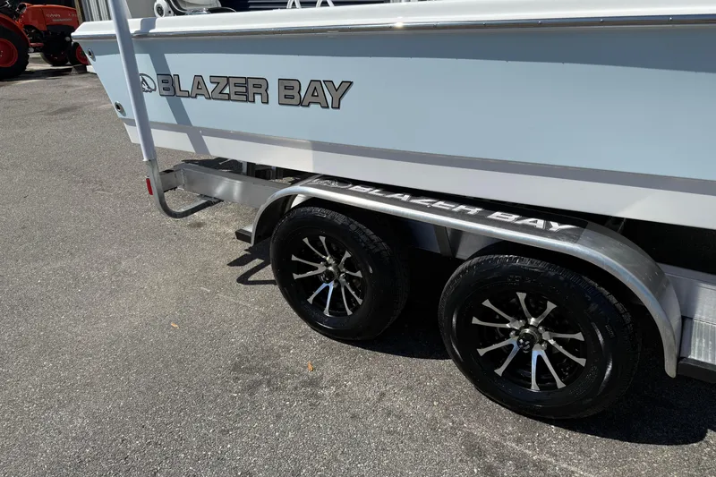 Slide: The Image of 2026 Blazer 2550 GTS boat trailer with dual black alloy wheels. - 4