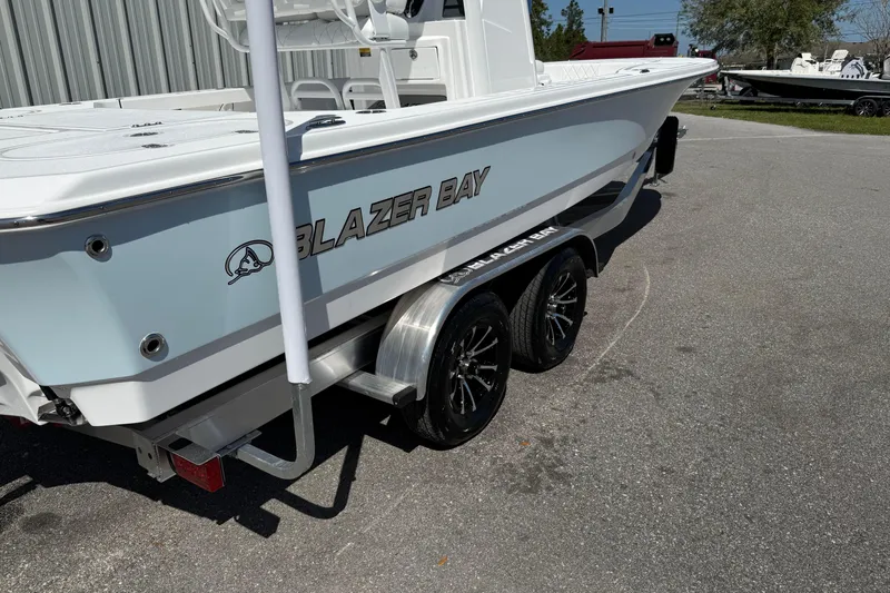 Slide: The Image of 2026 Blazer 2550 GTS boat on trailer, featuring sleek design and modern wheels. - 5