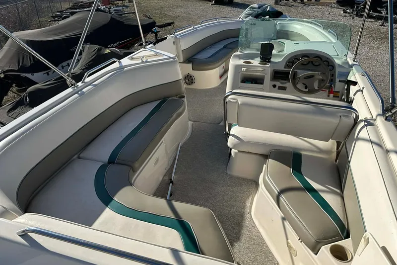Slide: The Image of 1998 Bayliner 2659 Rendezvous boat interior with seating and steering wheel. - 13