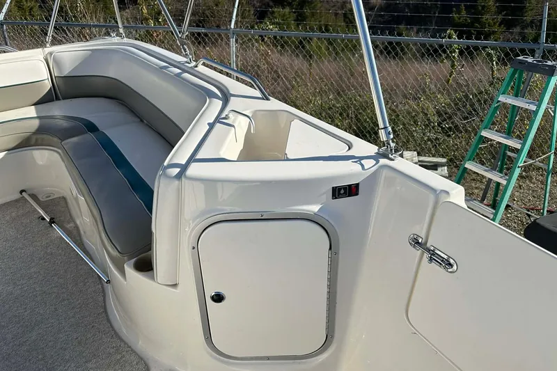 Slide: The Image of 1998 Bayliner 2659 Rendezvous boat interior with seating and storage compartment. - 17