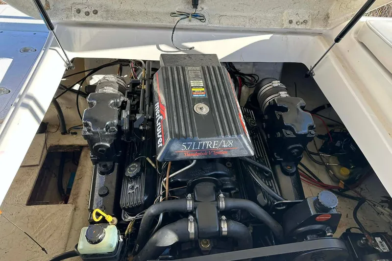 Slide: The Image of Engine compartment of a 1998 Bayliner 2659 Rendezvous with a 5.7L V8 MerCruiser engine. - 2