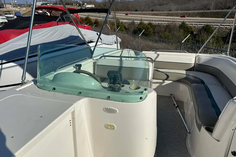 Slide: The Image of 1998 Bayliner 2659 Rendezvous boat interior with steering console and seating area. - 20