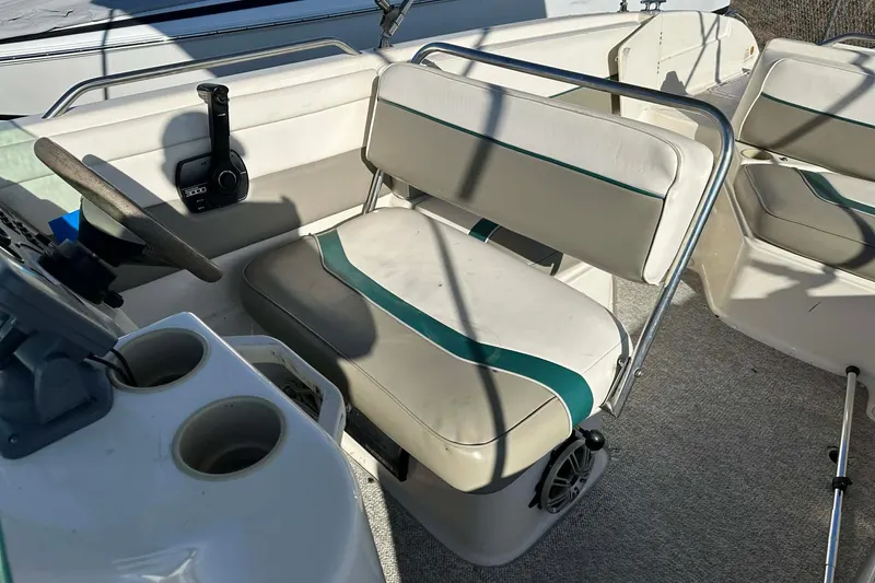 Slide: The Image of 1998 Bayliner 2659 Rendezvous boat interior with steering wheel and seating. - 21
