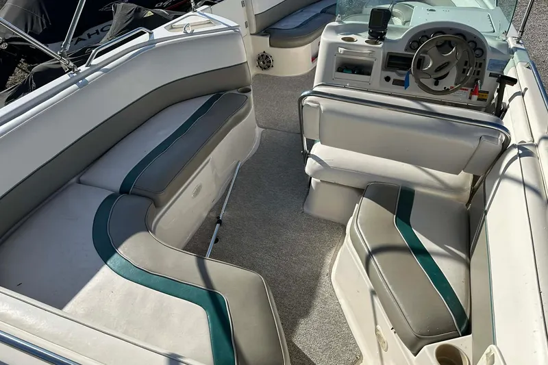 Slide: The Image of 1998 Bayliner 2659 Rendezvous boat interior with seating and steering wheel. - 5