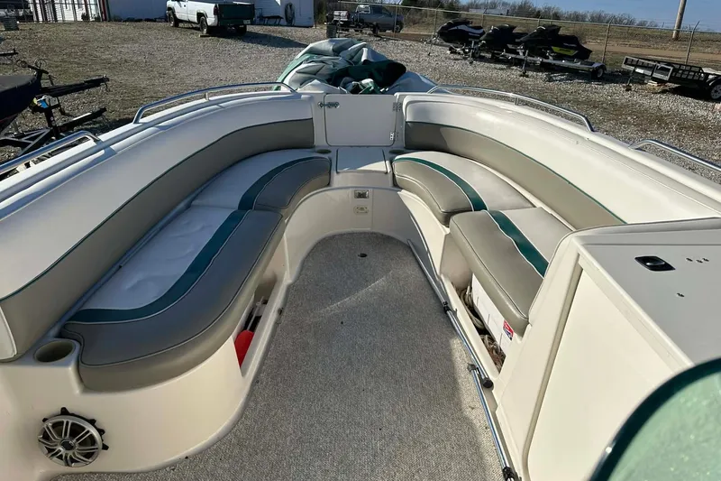 Slide: The Image of 1998 Bayliner 2659 Rendezvous boat interior with spacious seating and storage compartments. - 7