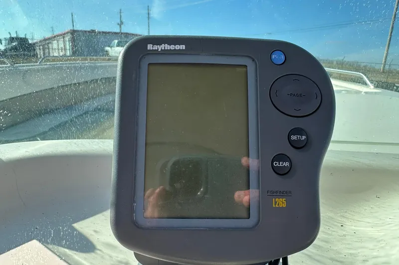 Slide: The Image of Raytheon Fishfinder L265 on 1998 Bayliner 2659 Rendezvous boat dashboard. - 9