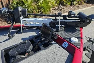 Slide: The Image of 2025 Tracker Savage 215 boat deck with trolling motor and control panel. - 10