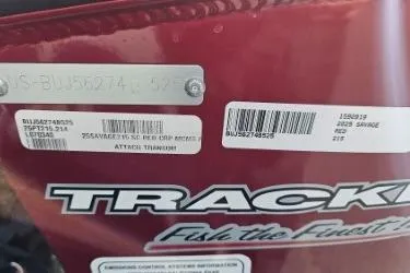 Slide: The Image of 2025 Tracker Savage 215 boat with identification labels and logo. - 11