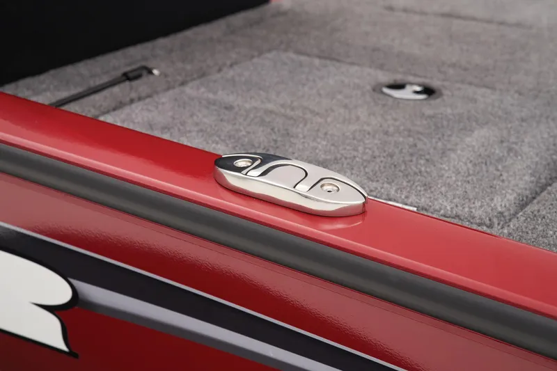 Slide: The Image of Manufacturer Provided Image: Red Tracker Savage 215 boat detail, featuring a sleek cleat on a carpeted deck, 2025 model. - 34