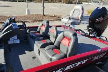 Slide: The Image of 2025 Tracker Savage 215 boat dashboard with steering wheel and electronic displays. - 6