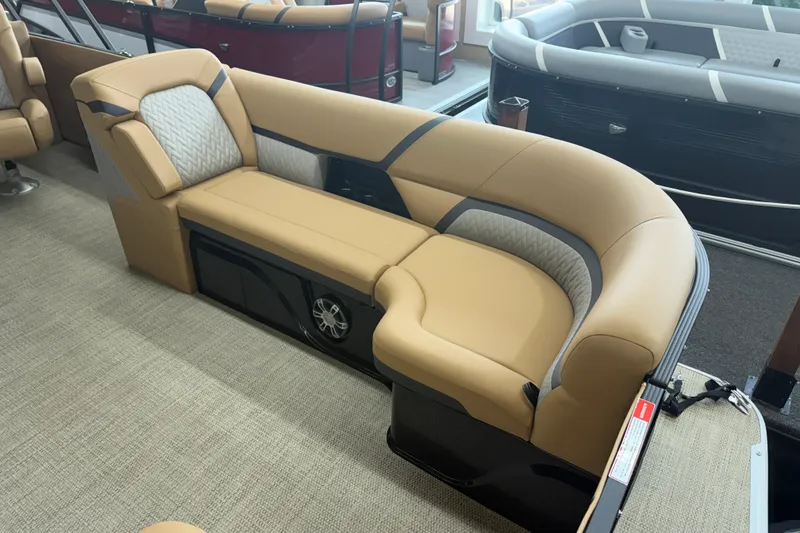 Slide: The Image of Luxurious seating on 2026 Crest Caribbean 230 SLC boat, featuring elegant tan upholstery. - 2