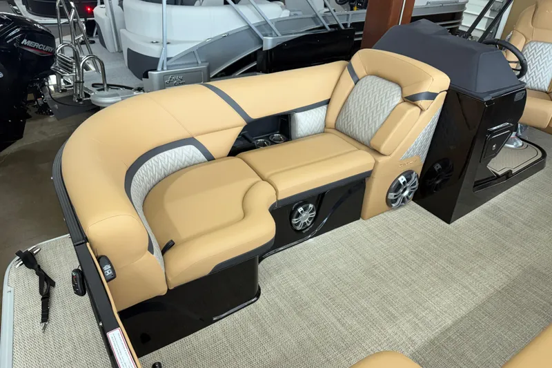 Slide: The Image of 2026 Crest Caribbean 230 SLC boat interior with tan seating and modern design. - 3