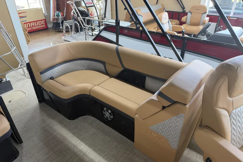 Slide: The Image of 2026 Crest Caribbean 230 SLC boat interior with beige seating and modern design. - 4
