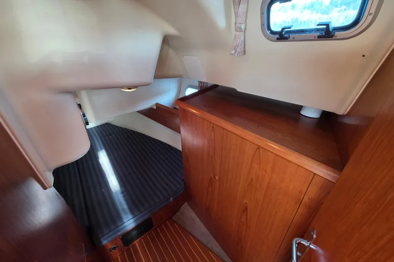 Slide: The Image of Interior cabin of 1999 Jeanneau Sun Odyssey 40 DS with wood finish and window. - 17